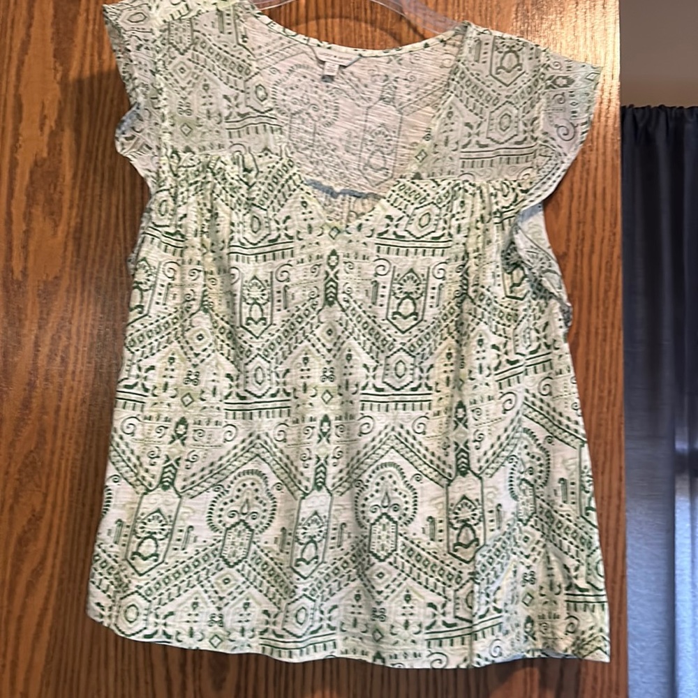 Cute green and white print sleeveless blouse